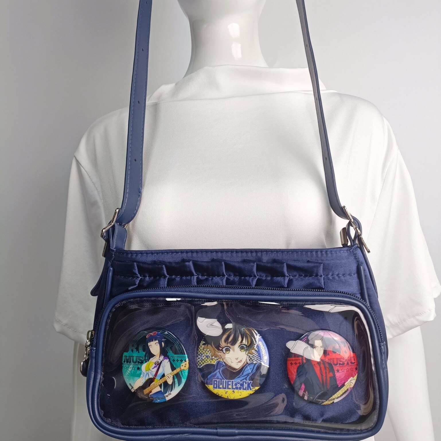 Blue Ita Crossbody Bag with Clear Window and Included Insert for Pin Display